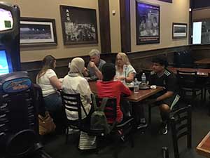 neighbors at welcome dinner for ESL students from Japan