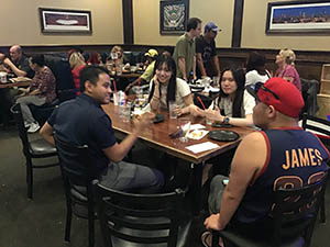 neighbors at welcome dinner for ESL students from Japan