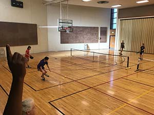 neighbors playing pickleball