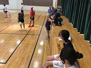 neighbors playing pickleball