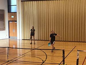 neighbors playing pickleball