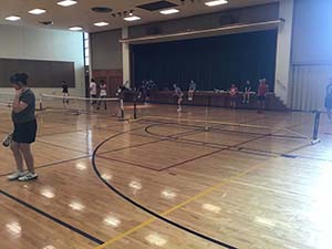 neighbors playing pickleball