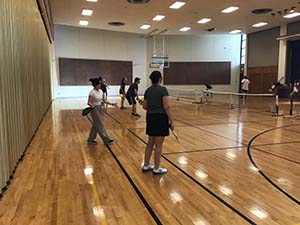 neighbors playing pickleball