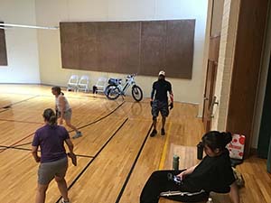 neighbors playing pickleball