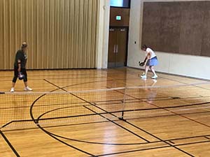 neighbors playing pickleball