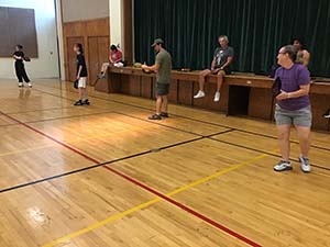 neighbors playing pickleball