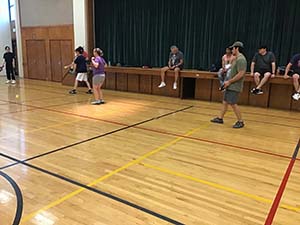 neighbors playing pickleball