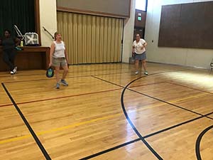 neighbors playing pickleball