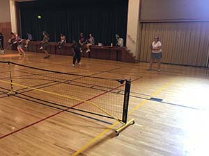 neighbors playing pickleball