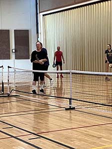 neighbors playing pickleball