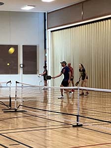 neighbors playing pickleball