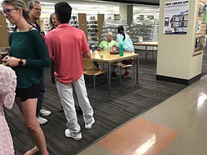 neighbors at art reception at Tempe Public Library