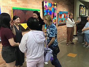 neighbors at art reception at Tempe Public Library