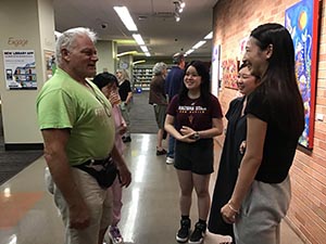 neighbors at art reception at Tempe Public Library