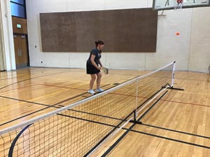 neighbors playing pickleball