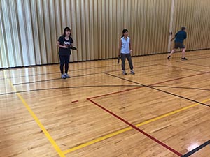 neighbors playing pickleball