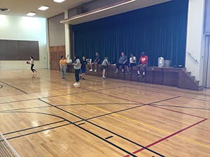 neighbors playing pickleball