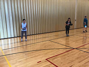 neighbors playing pickleball