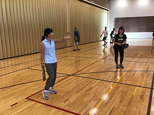 neighbors playing pickleball