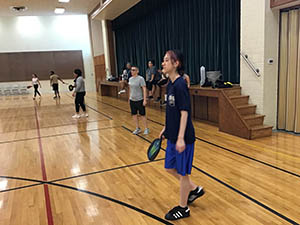 neighbors playing pickleball