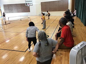 neighbors playing pickleball