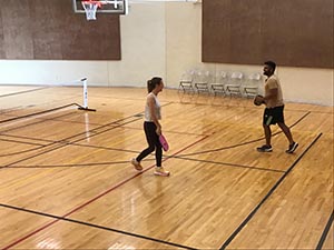 neighbors playing pickleball