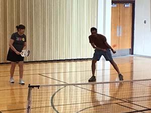 neighbors playing pickleball