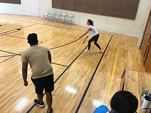 neighbors playing pickleball