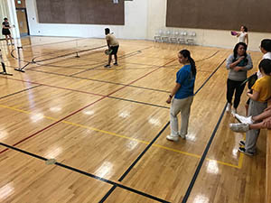 neighbors playing pickleball