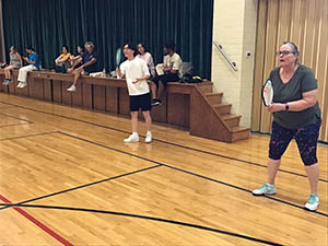 neighbors playing pickleball