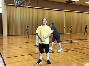 neighbors playing pickleball