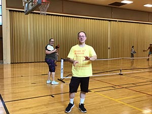 neighbors playing pickleball