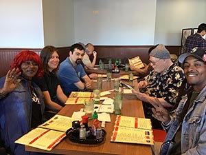 neighbors gathering for Christmas dinner at Chen's Noodle House