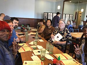 neighbors gathering for Christmas dinner at Chen's Noodle House