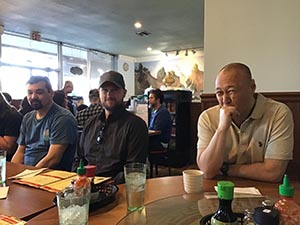 neighbors gathering for Christmas dinner at Chen's Noodle House