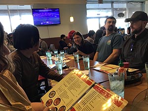 neighbors gathering for Christmas dinner at Chen's Noodle House