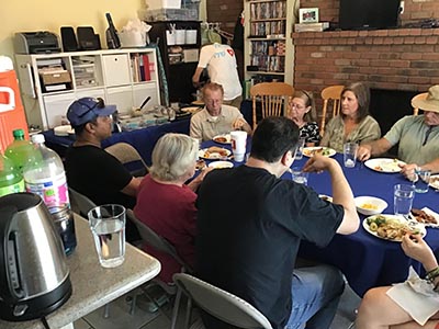 food and neighbors at potluck dinner discussion about the conflict in Israel and Gaza