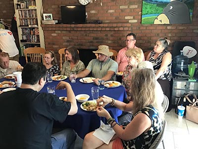 food and neighbors at potluck dinner discussion about the conflict in Israel and Gaza