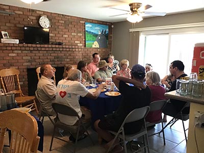 food and neighbors at potluck dinner discussion about the conflict in Israel and Gaza