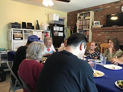 food and neighbors at potluck dinner discussion about the conflict in Israel and Gaza