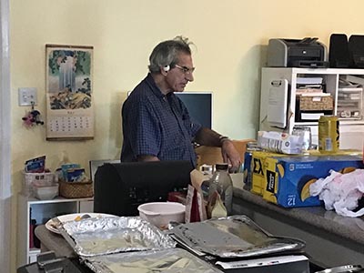 food and neighbors at potluck dinner discussion about the conflict in Israel and Gaza