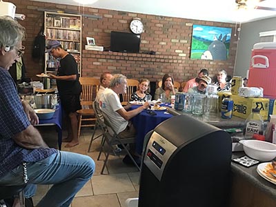 food and neighbors at potluck dinner discussion about the conflict in Israel and Gaza