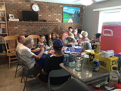 food and neighbors at potluck dinner discussion about the conflict in Israel and Gaza