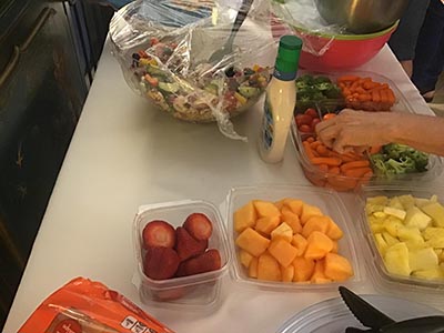 neighbors and food at Meow Mixer potluck lunch