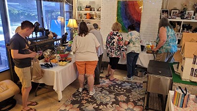 neighbors and food at Meow Mixer potluck lunch