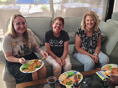 neighbors and food at Meow Mixer potluck lunch