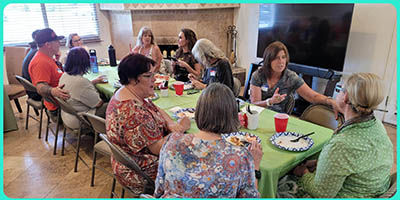 neighbors gather at gardeners potluck brunch