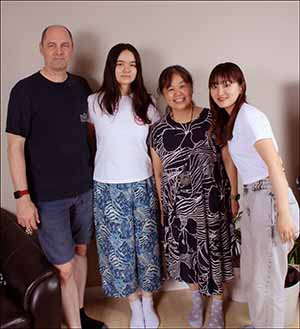 professional portrait photo of Kotone and neighbors at farewell open house for Kotone