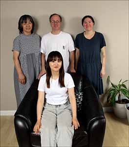 professional portrait photo of Kotone and neighbors at farewell open house for Kotone