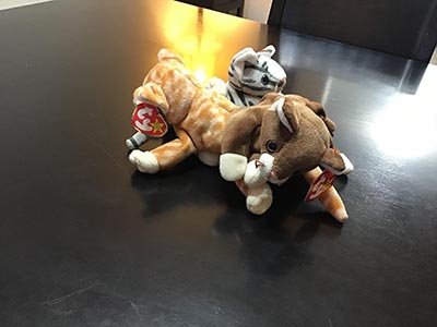 stuffed / plush cat toys on a table at the Meow-Mixer cat-lovers potluck lunch event